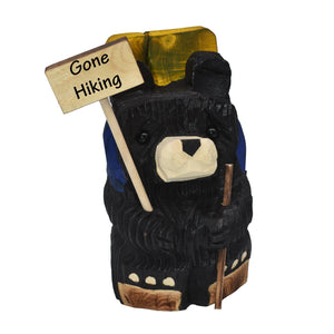 Wood Carved Hiking Bear Holding a Sign